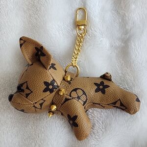 Luxury Tan Dog Iconic Logo Bag Charm with Gold Accents
